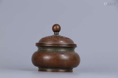 A BRONZE CENSER WITH COVER