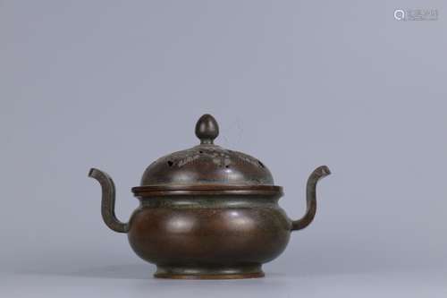 A BRONZE CENSER WITH COVER