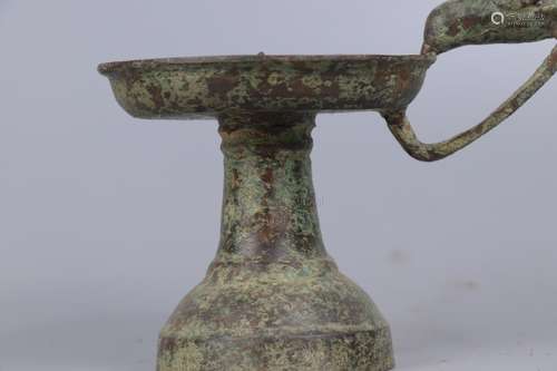 A BRONZE 'BIRD' CANDLE HOLDER