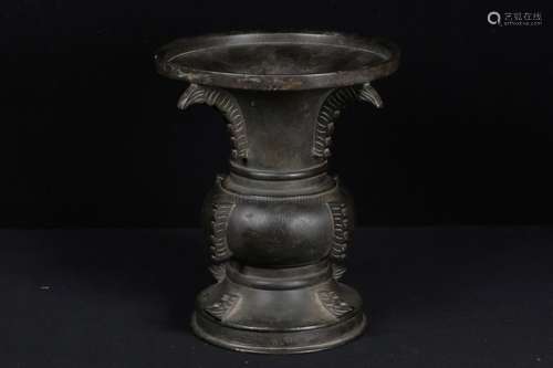 A BRONZE BEAKER VASE