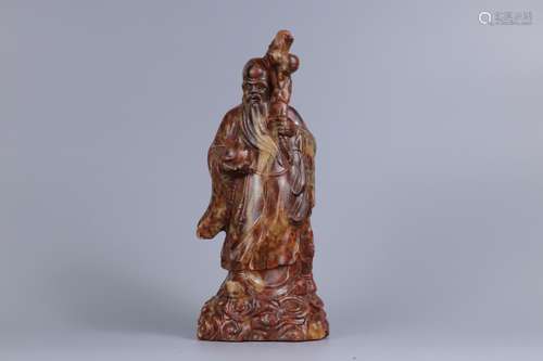 A CARVED HETIAN JADE FIGURE OF THE GOD OF LONGEVITY