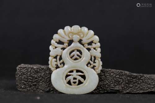 A CARVED WHITE JADE PLAQUE