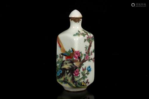 A FAMILLE ROSE MOLDED 'FLOWER AND BIRD' PORCELAIN SNUFF BOTTLE