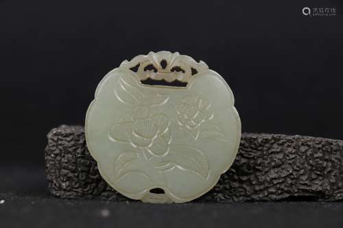 A CARVED WHITE JADE PLAQUE