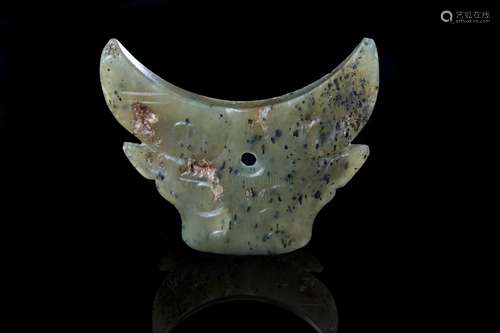 A JADE CARVING OF OX HEAD, SHANG DYNASTY