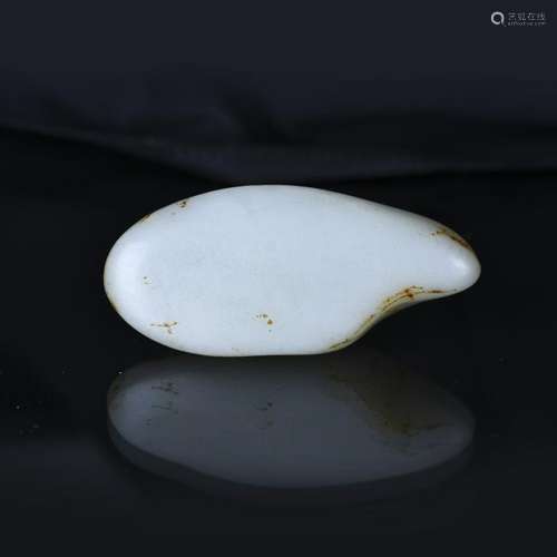 AN IRREGULAR-SHAPED HETIAN WHITE JADE