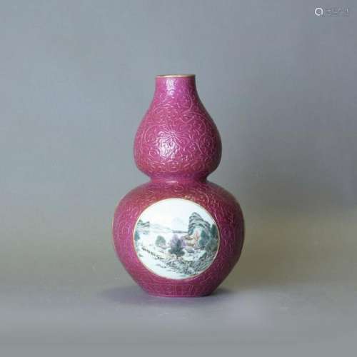 A RUBY-GROUND FAMILLE ROSE DOUBLE-GOURD VASE