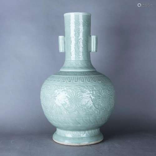 A LARGE CELADON RELIEF-DECORATED FLORAL VASE