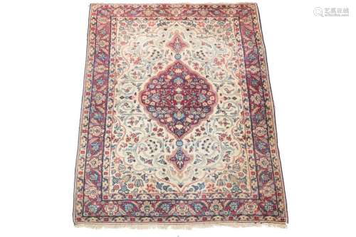 Kerman rug \nCream coloured ground, decorated with …