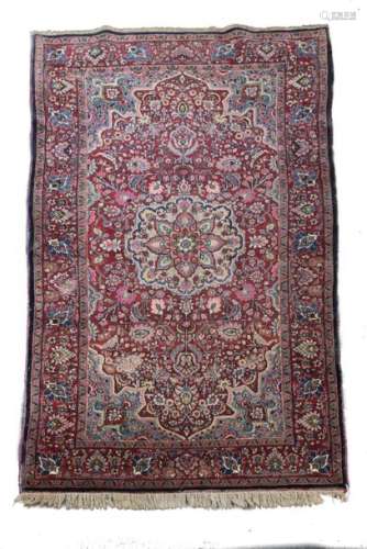 Kerman rug \nRed ground, decorated with a blue rhom…