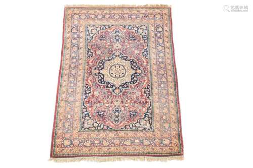 Tehran rug \nRed ground with rinceaux around a blue…