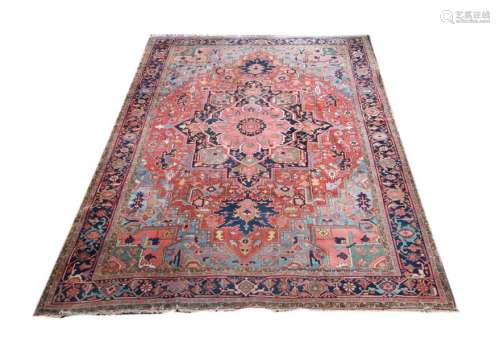 Heriz rug \nRed ground, decorated with a large blue…