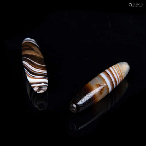 A Pair of Chinese Carved Agate DZI Beads