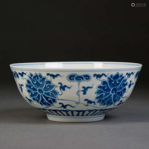 A BLUE AND WHITE LARGE BOWL WITH FLOWERS