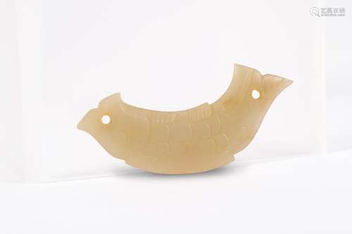 A CARVED FISH SHAPED JADE PENDANT