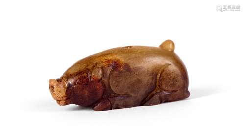 A CARVED JADE PIG DECORATION