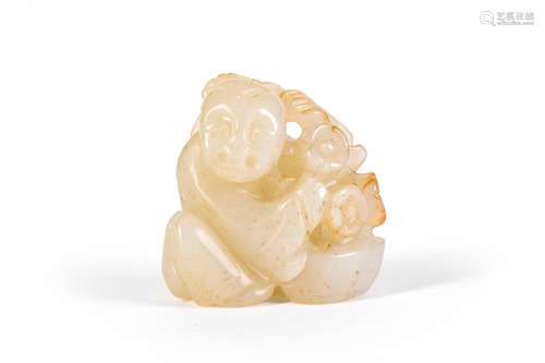 A CARVED JADE BOY DECORATION