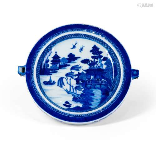 A BLUE AND WHITE DISH WITH LANDSCAPES