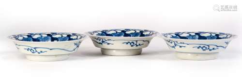 A GROUP OF BLUE AND WHITE PLATES WITH FLOWERS