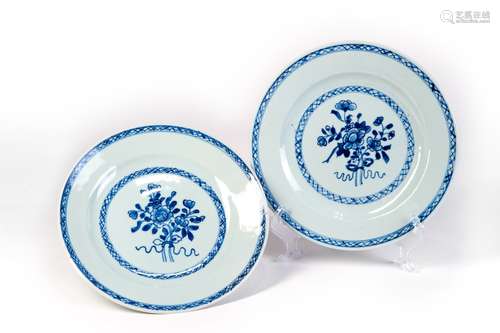 A GROUP OF BLUE AND WHITE DISH WITH FLOWERS