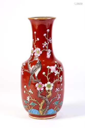 A RED GLAZED VASE WITH BIRDS AND FLOWERS