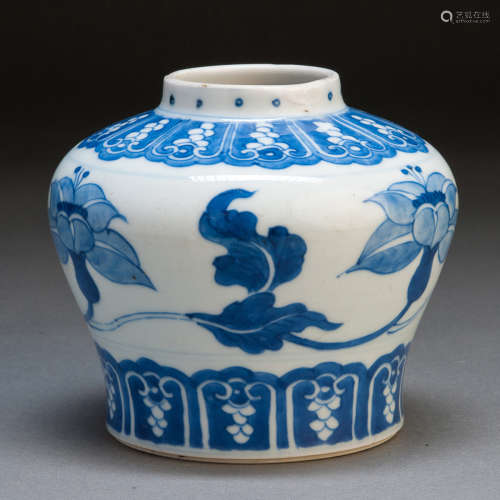 A BLUE AND WHITE JAR WITH FLOWERS
