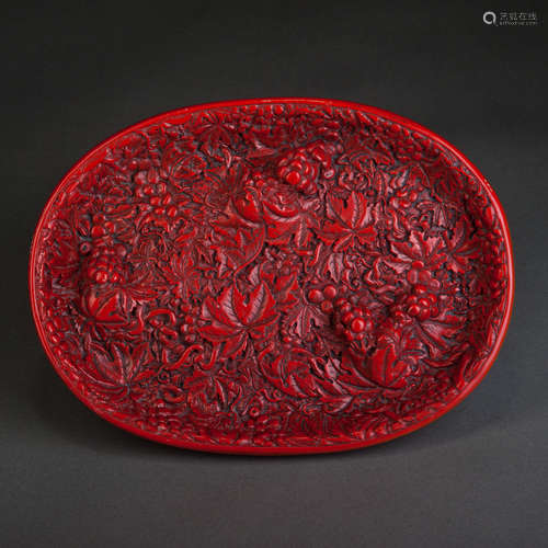 A RED CARVED LACQUER DISH