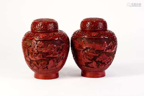 A PAIR OF RED CARVED LACQUER COVERD JARS