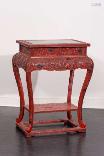 A RED CARVED LACQUER TABLE