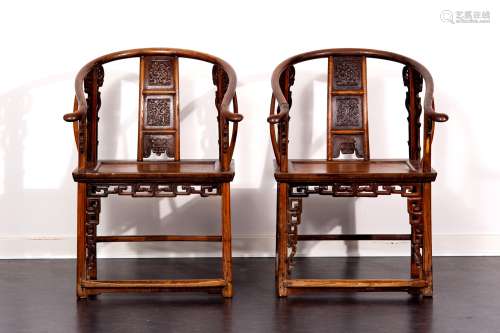 A PAIR OF HARD WOOD ARMCHAIRS
