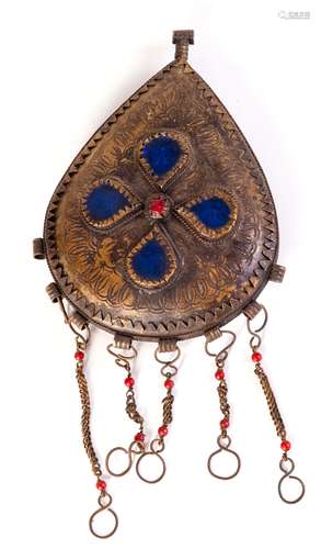 A CARVED COPPER PENDANT WITH GEM