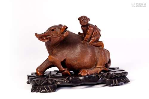 A CARVED WOOD DECORATIONS WITH BOY AND CATTLE