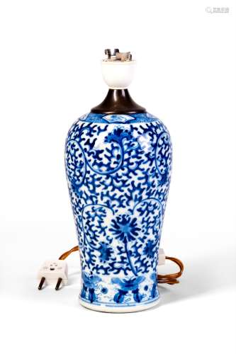 A BLUE AND WHITE VASE WITH FLOWERS