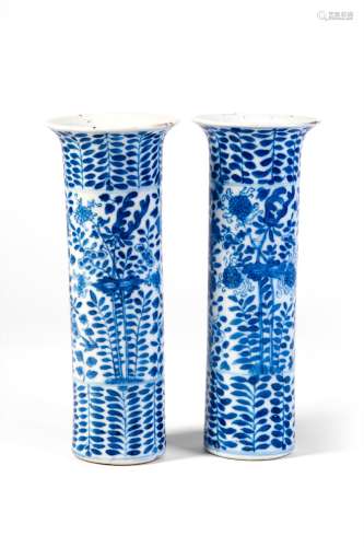 A PAIR OF BLUE AND WHITE VASES WITH FLOWERS