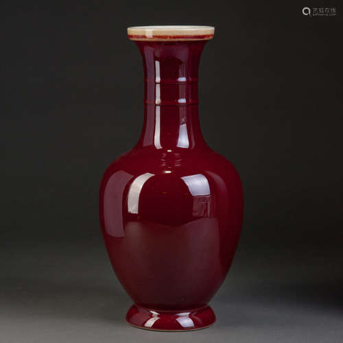 A RED GLAZED VASE