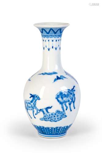 A BLUE AND WHITE VASE WITH THREE SHEEP