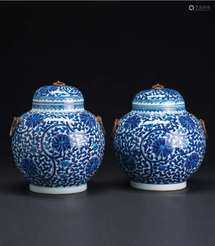 A PAIR OF BLUE AND WHITE JARS WITH FLOWERS