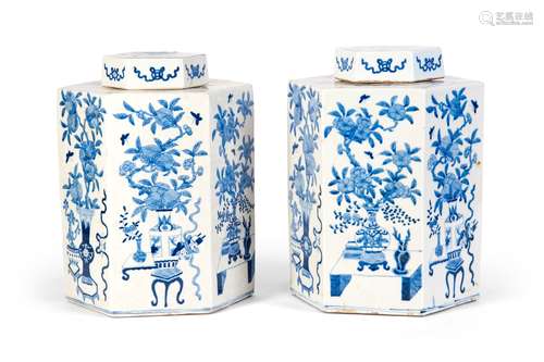 A PAIR OF BLUE AND WHITE JARS WITH FLOWERS