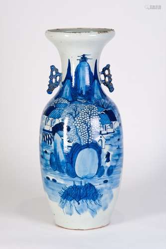 A BLUE AND WHITE VASE WITH LANDSCAPES