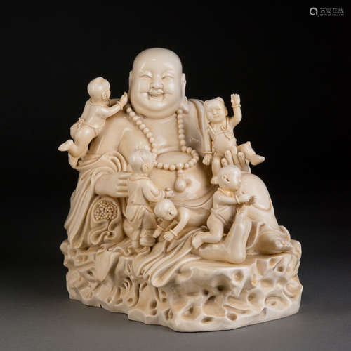 A WHITE PORCELAIN MAITREYA BUDDHA WITH FIVE BOYS