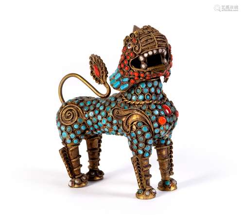 A CARVED COPPER QILIN DECORATIONS WITH GEM