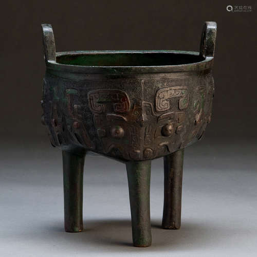 A CARVED COPPER TRIPOD