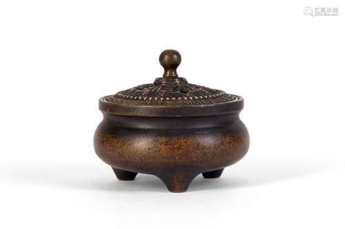 A CARVED COPPER CENSER WITH TRIPLE FEET