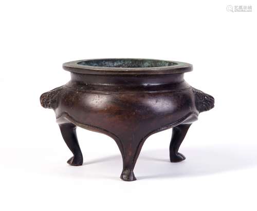 A CARVED COPPER CENSER WITH TRIPLE FEET