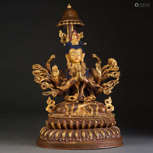 A GILT CARVED COPPER FIGURE OF GUANYIN