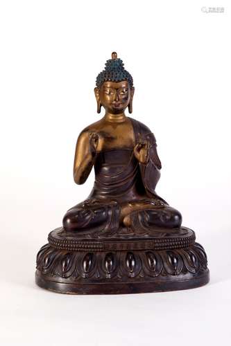 A CARVED COPPER GAUTAMA BUDDHA