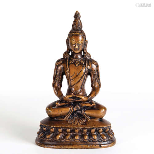 A CARVED COPPER FIGURE OF GUANYIN