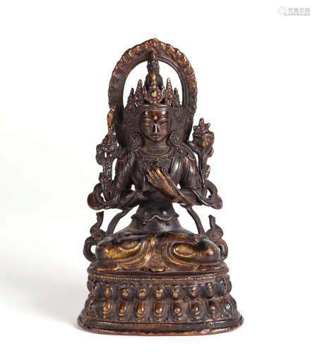 A CARVED COPPER FIGURE OF GUANYIN