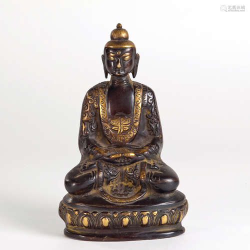 A GILT CARVED COPPER FIGURE OF BUDDHA