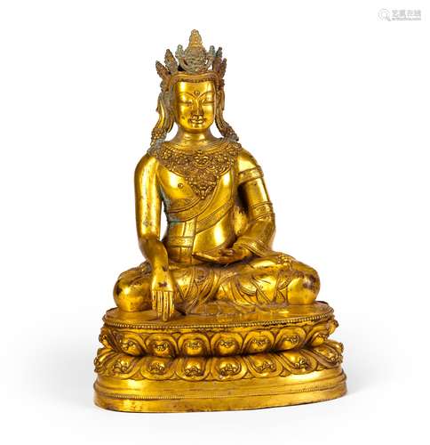 A GILT CARVED COPPER FIGURE OF GUANYIN